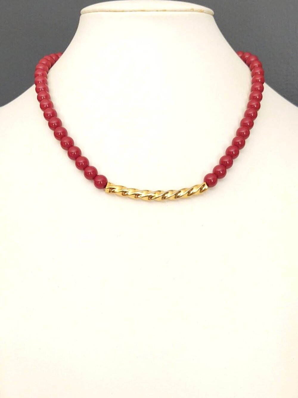 Vintage Trifari rusty red beaded necklace with twisted gold curved center bar